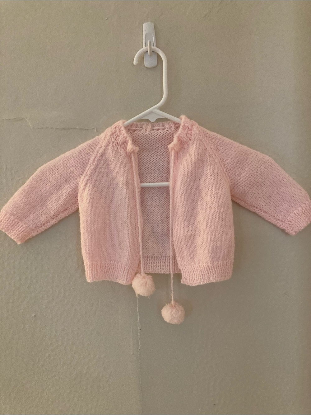 Soft Pink HandKnit Baby Cardigan with Pom-Pom Ties